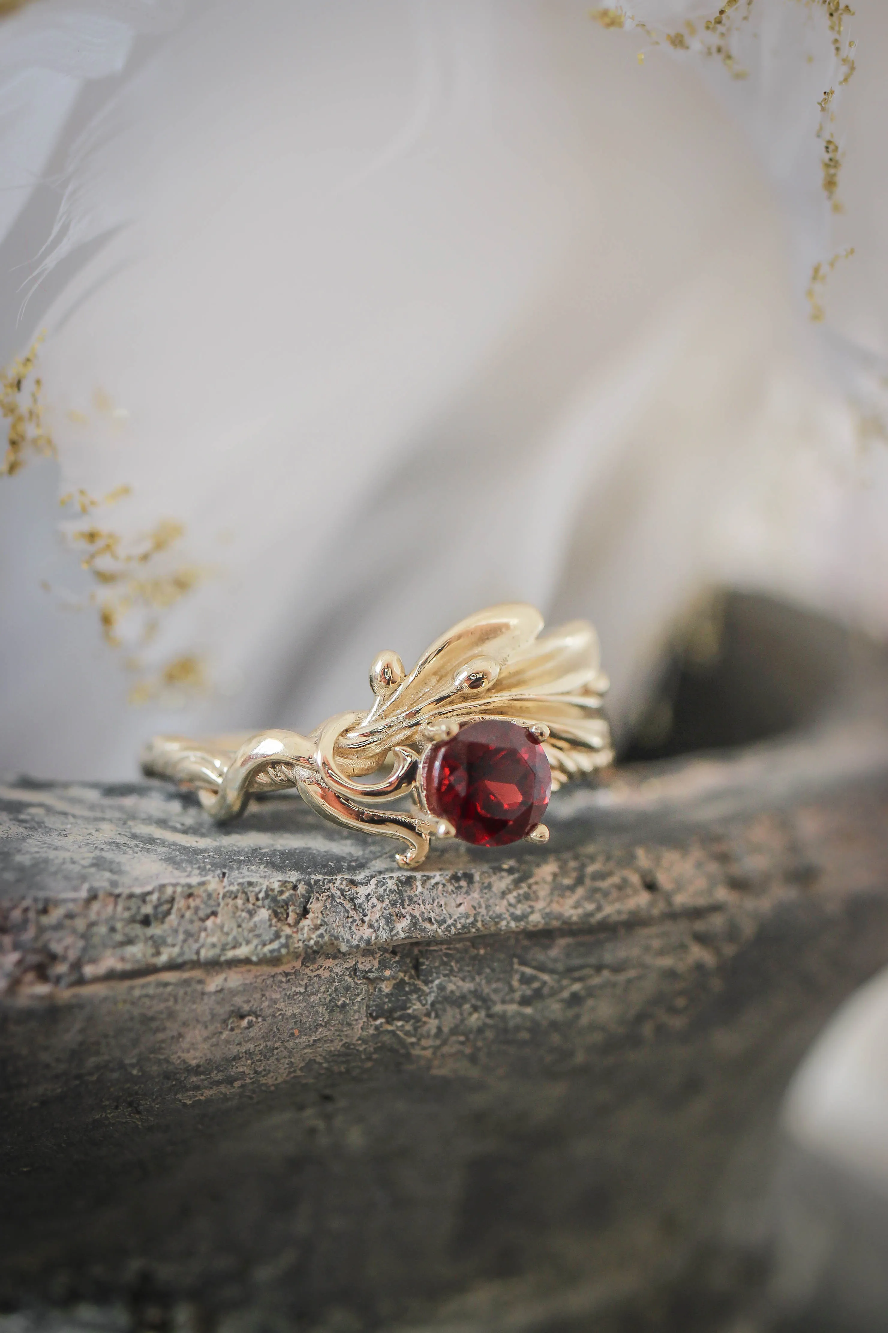 Olive branch ring with ribbon and red garnet